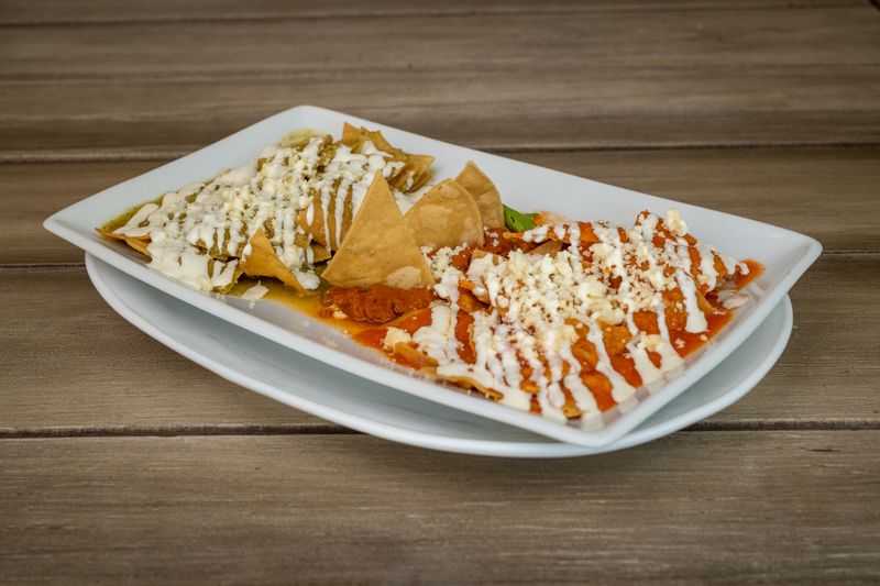 Cheese enchiladas with queso sauce and pico