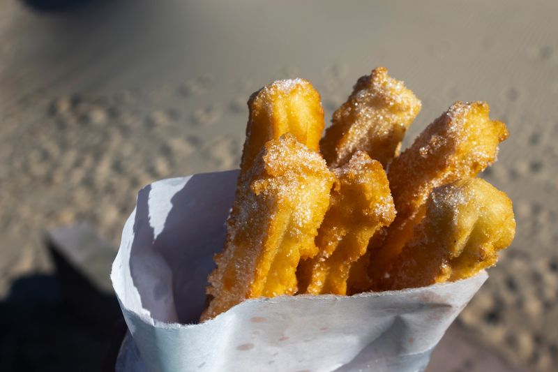 Churros dusted with cinnamon sugar and chocolate sauce